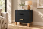 Fluted black nightstand, three-quarter right view in a styled room